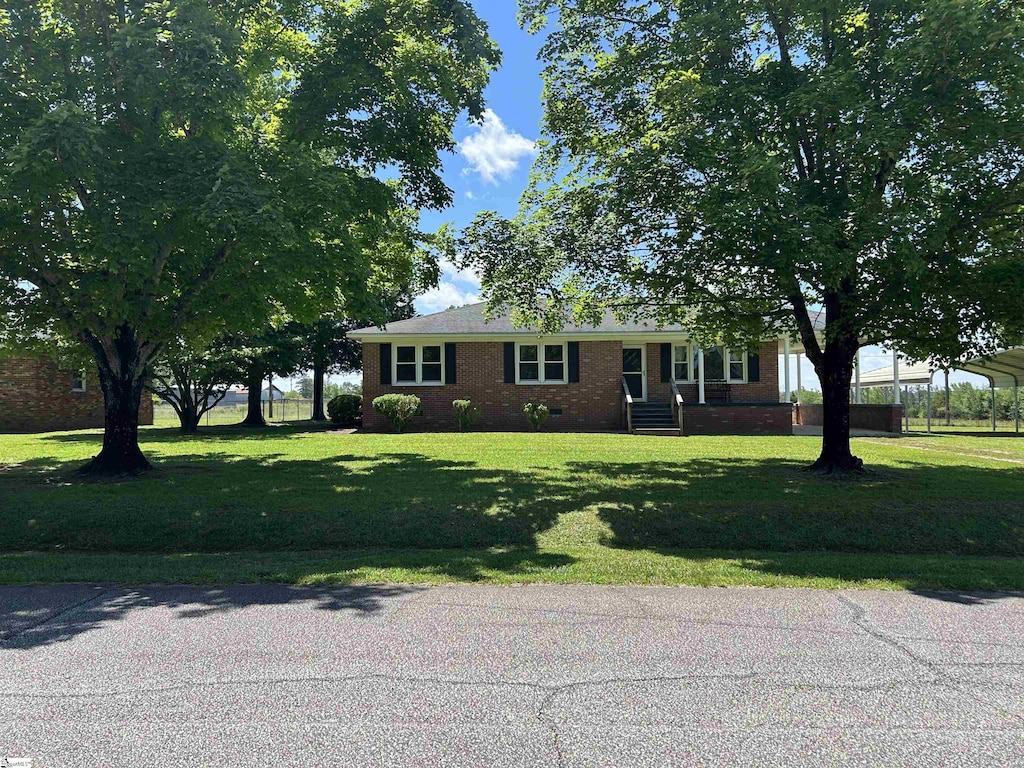 325 Byrnes St, Joanna, SC 29351 - view of front of property with brick siding and a front lawn