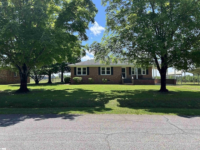 325 Byrnes St, Joanna, SC 29351 - view of front of property with brick siding and a front lawn