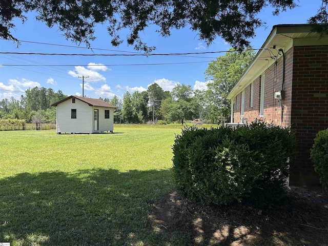 325 Byrnes St, Joanna, SC 29351 - view of green lawn featuring an outbuilding