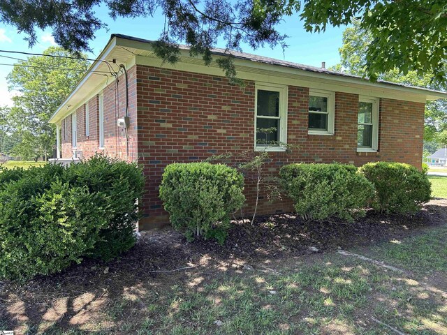 325 Byrnes St, Joanna, SC 29351 - view of side of property featuring brick siding