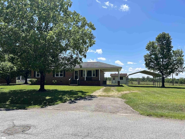 325 Byrnes St, Joanna, SC 29351 - view of front of home with a carport, covered porch, driveway, and a front yard
