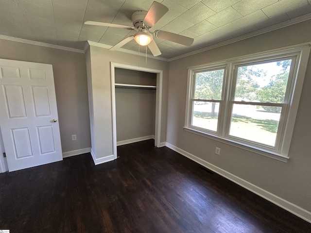 325 Byrnes St, Joanna, SC 29351 - unfurnished bedroom featuring dark wood-style flooring, a closet, baseboards, ornamental molding, and a ceiling fan