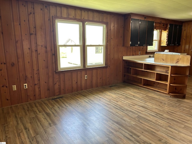 325 Byrnes St, Joanna, SC 29351 - kitchen featuring open shelves, light wood-style floors, light countertops, and wood walls