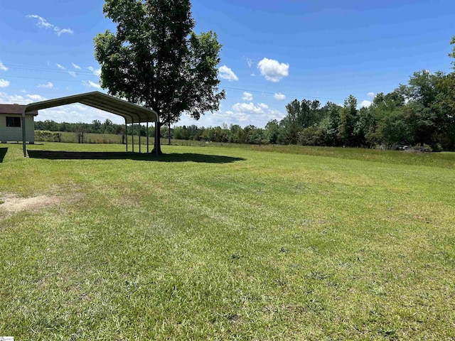 325 Byrnes St, Joanna, SC 29351 - view of grassy yard with a carport