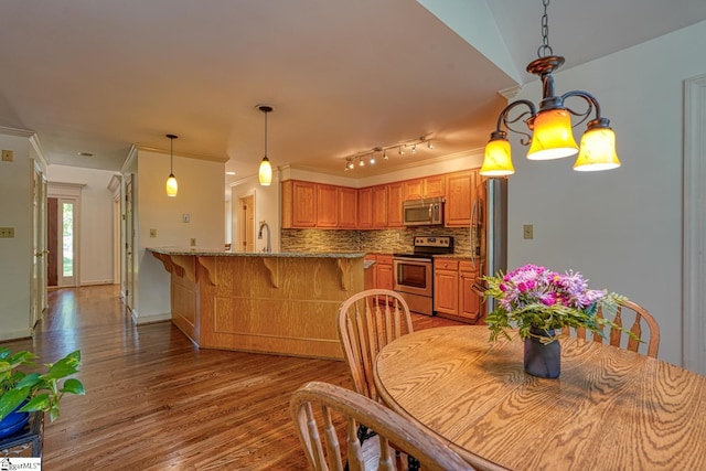201 Woodridge Dr, Spartanburg, SC 29301 - dining room featuring light wood finished floors and crown molding