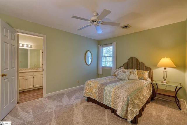 201 Woodridge Dr, Spartanburg, SC 29301 - bedroom with carpet flooring, baseboards, ensuite bathroom, and a ceiling fan