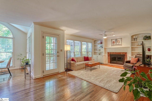 201 Woodridge Dr, Spartanburg, SC 29301 - living area featuring a fireplace, wood finished floors, ornamental molding, ceiling fan, and baseboards