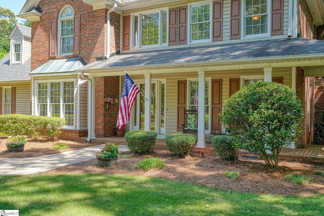 201 Woodridge Dr, Spartanburg, SC 29301 - doorway to property featuring covered porch and brick siding