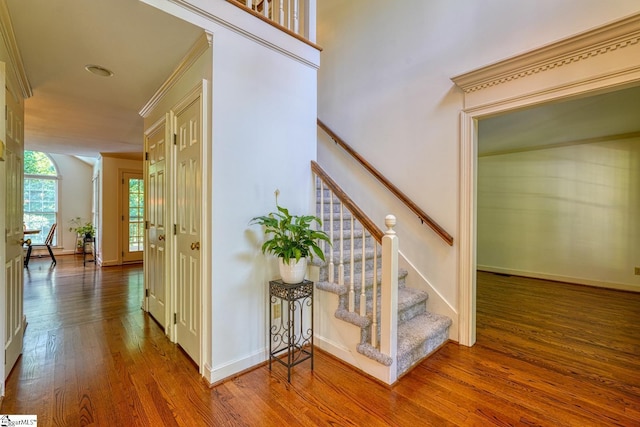 201 Woodridge Dr, Spartanburg, SC 29301 - stairs with wood finished floors, crown molding, and baseboards