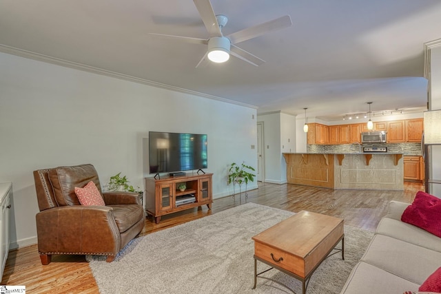 201 Woodridge Dr, Spartanburg, SC 29301 - living room with crown molding, light wood-type flooring, a ceiling fan, and baseboards