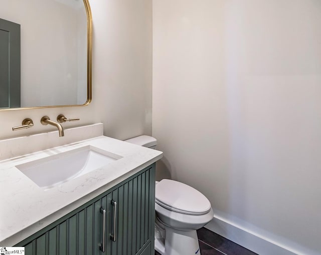 11 Stall St, Greenville, SC 29609 - half bath with toilet, vanity, and tile patterned flooring