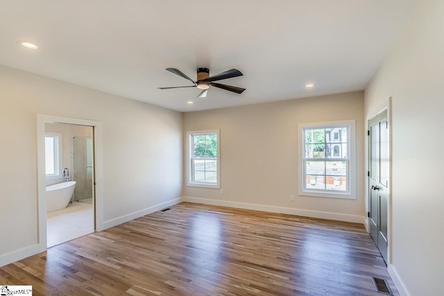11 Stall St, Greenville, SC 29609 - spare room featuring healthy amount of natural light, wood finished floors, a ceiling fan, baseboards, and recessed lighting
