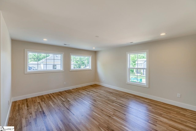 11 Stall St, Greenville, SC 29609 - unfurnished room with plenty of natural light, wood finished floors, baseboards, and recessed lighting