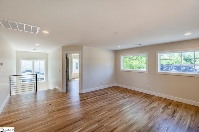 11 Stall St, Greenville, SC 29609 - empty room featuring baseboards, light wood-style floors, and recessed lighting