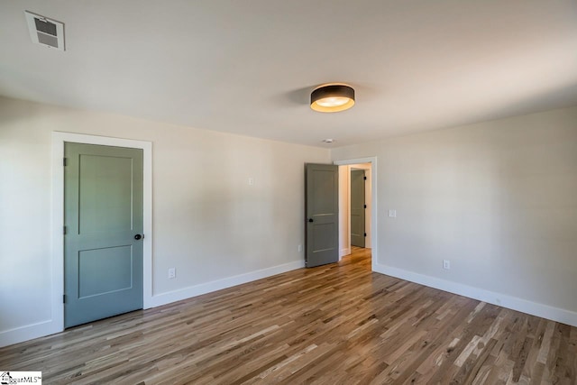 11 Stall St, Greenville, SC 29609 - unfurnished room featuring wood finished floors and baseboards