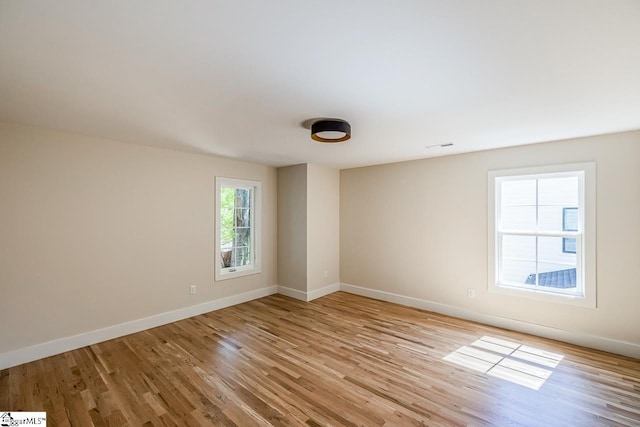 11 Stall St, Greenville, SC 29609 - empty room featuring light wood-style floors and baseboards