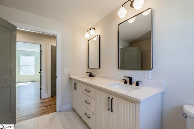 11 Stall St, Greenville, SC 29609 - bathroom with double vanity, toilet, baseboards, and tile patterned floors