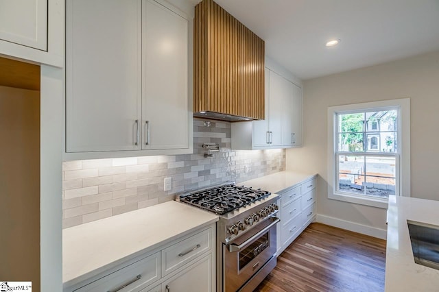 11 Stall St, Greenville, SC 29609 - kitchen featuring stainless steel stove, white cabinets, baseboards, and recessed lighting