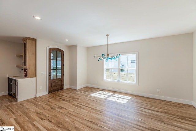 11 Stall St, Greenville, SC 29609 - unfurnished dining area featuring plenty of natural light, light wood-style floors, baseboards, and recessed lighting