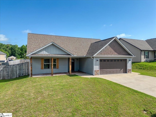 624 Renita Dr, Boiling Springs, SC 29316 - view of front facade featuring a garage, concrete driveway, covered porch, and a shingled roof