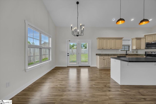 624 Renita Dr, Boiling Springs, SC 29316 - kitchen with appliances with stainless steel finishes, cream cabinetry, a chandelier, plenty of natural light, and high vaulted ceiling