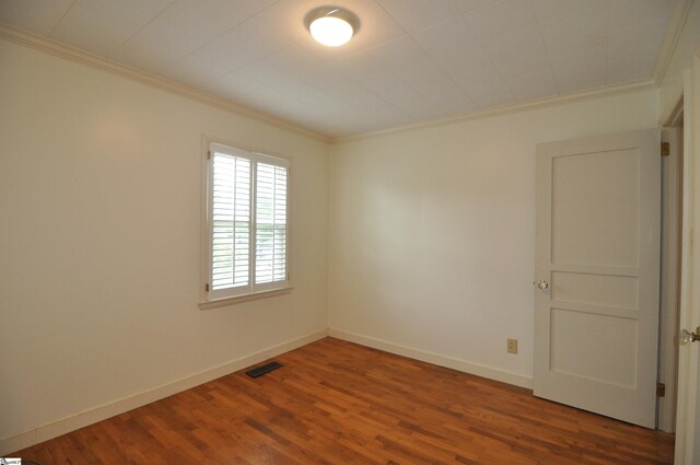 105 S Oakleaf Dr, Landrum, SC 29356 - spare room featuring crown molding, wood finished floors, and baseboards