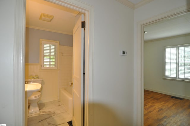 105 S Oakleaf Dr, Landrum, SC 29356 - full bathroom with crown molding, toilet, a wainscoted wall, and shower / bath combination