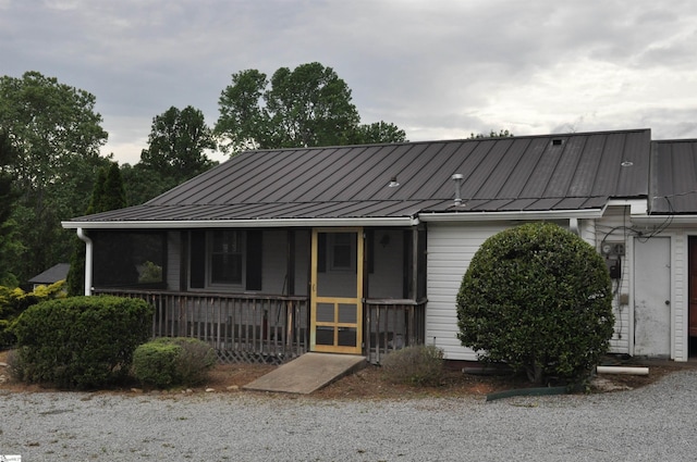 105 S Oakleaf Dr, Landrum, SC 29356 - view of front facade featuring metal roof, a standing seam roof, and a porch