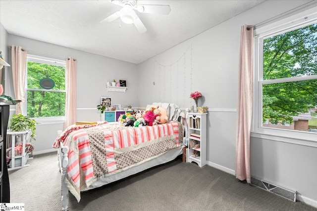 116 Kennedy St, Easley, SC 29642 - carpeted bedroom with multiple windows, baseboards, and ceiling fan
