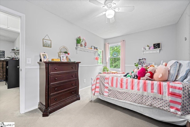 116 Kennedy St, Easley, SC 29642 - carpeted bedroom featuring a textured ceiling, baseboards, and a ceiling fan