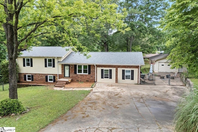 116 Kennedy St, Easley, SC 29642 - split level home featuring a front yard, concrete driveway, a gate, brick siding, and a shingled roof