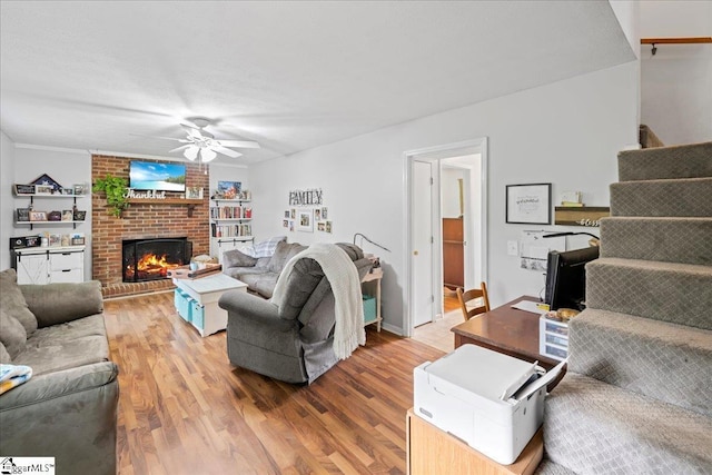 116 Kennedy St, Easley, SC 29642 - living room featuring a ceiling fan, wood finished floors, and a brick fireplace