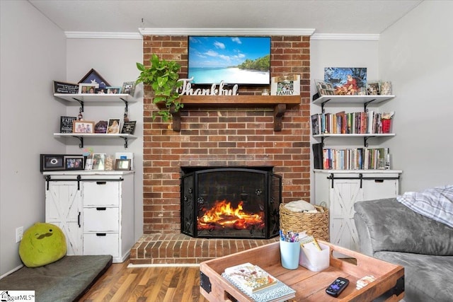 116 Kennedy St, Easley, SC 29642 - living area with crown molding, wood finished floors, and a brick fireplace