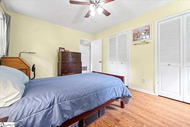 116 Kennedy St, Easley, SC 29642 - bedroom with two closets, light wood finished floors, baseboards, and a ceiling fan