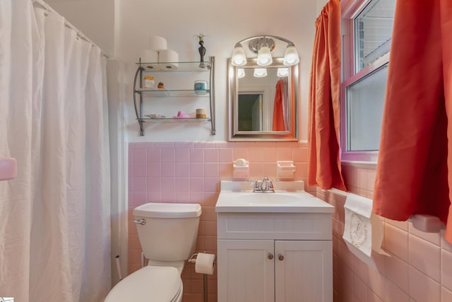 2807 Bellview Rd, Anderson, SC 29621 - bathroom featuring tile walls, vanity, toilet, a wainscoted wall, and a shower with shower curtain