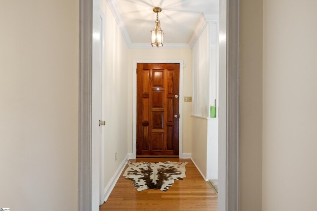 2807 Bellview Rd, Anderson, SC 29621 - doorway featuring ornamental molding, light wood-style flooring, and baseboards