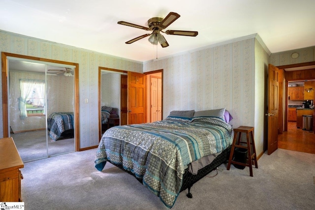 345 P Cromer Rd, Abbeville, SC 29620 - carpeted bedroom featuring wallpapered walls, two closets, and a ceiling fan