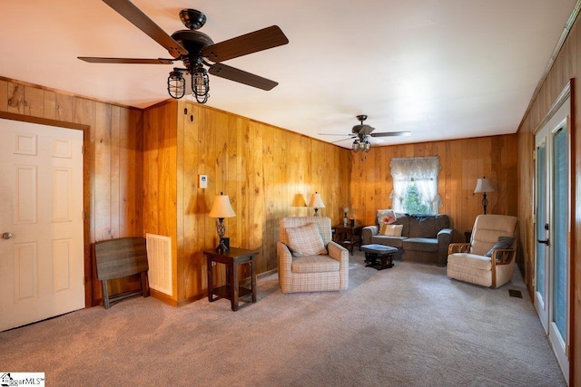 345 P Cromer Rd, Abbeville, SC 29620 - living room featuring wooden walls, ceiling fan, and carpet flooring