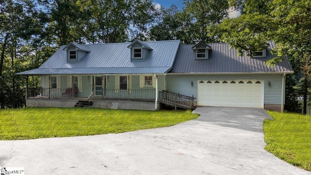 345 P Cromer Rd, Abbeville, SC 29620 - view of front of house featuring a porch, asphalt driveway, a front lawn, a garage, and metal roof