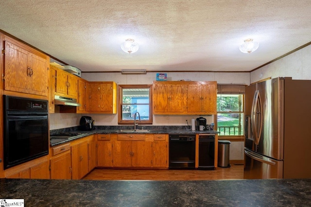 345 P Cromer Rd, Abbeville, SC 29620 - kitchen featuring black appliances, a sink, under cabinet range hood, healthy amount of natural light, and a textured ceiling