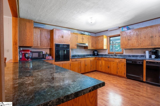 345 P Cromer Rd, Abbeville, SC 29620 - kitchen featuring black appliances, a sink, dark countertops, under cabinet range hood, and a textured ceiling