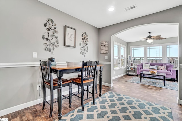 105 Devonfield Dr, Greer, SC 29651 - dining space with arched walkways, wood finished floors, baseboards, and ceiling fan