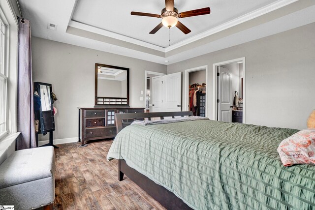 105 Devonfield Dr, Greer, SC 29651 - bedroom featuring wood finished floors, a tray ceiling, baseboards, ornamental molding, and ceiling fan