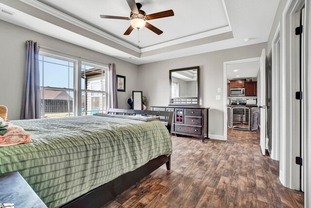 105 Devonfield Dr, Greer, SC 29651 - bedroom with a tray ceiling, dark wood-style floors, baseboards, ornamental molding, and ceiling fan