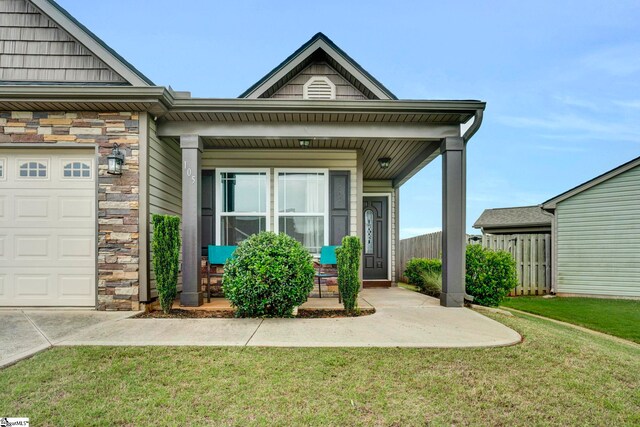105 Devonfield Dr, Greer, SC 29651 - view of front of property featuring covered porch, stone siding, and a garage