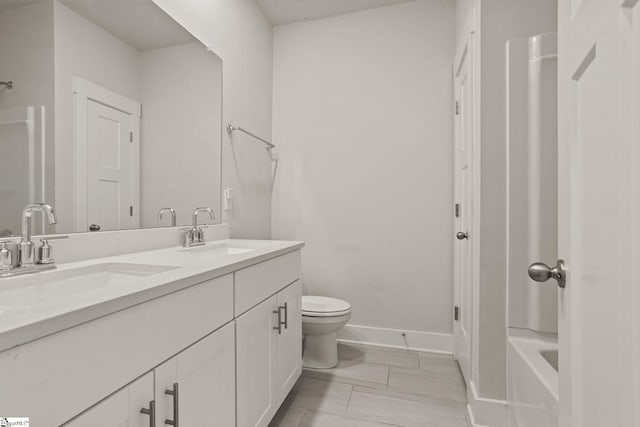 117 Hazelcroft Dr, Fountain Inn, SC 29644 - full bath with double vanity, toilet, baseboards, and shower / bathtub combination