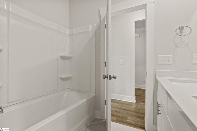 117 Hazelcroft Dr, Fountain Inn, SC 29644 - bathroom featuring tub / shower combination, baseboards, double vanity, and tile patterned flooring