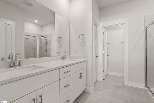117 Hazelcroft Dr, Fountain Inn, SC 29644 - full bathroom with a stall shower, double vanity, and baseboards