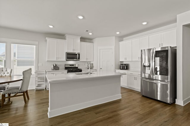 117 Hazelcroft Dr, Fountain Inn, SC 29644 - kitchen with appliances with stainless steel finishes, a sink, tasteful backsplash, white cabinetry, and light countertops