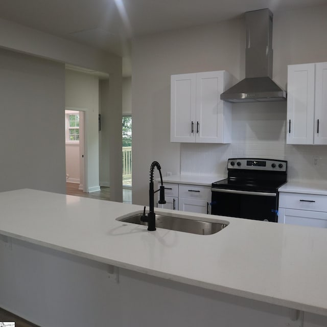 205 Magnolia St, Gaffney, SC 29340 - kitchen featuring wall chimney range hood, electric range, a sink, decorative backsplash, and light countertops